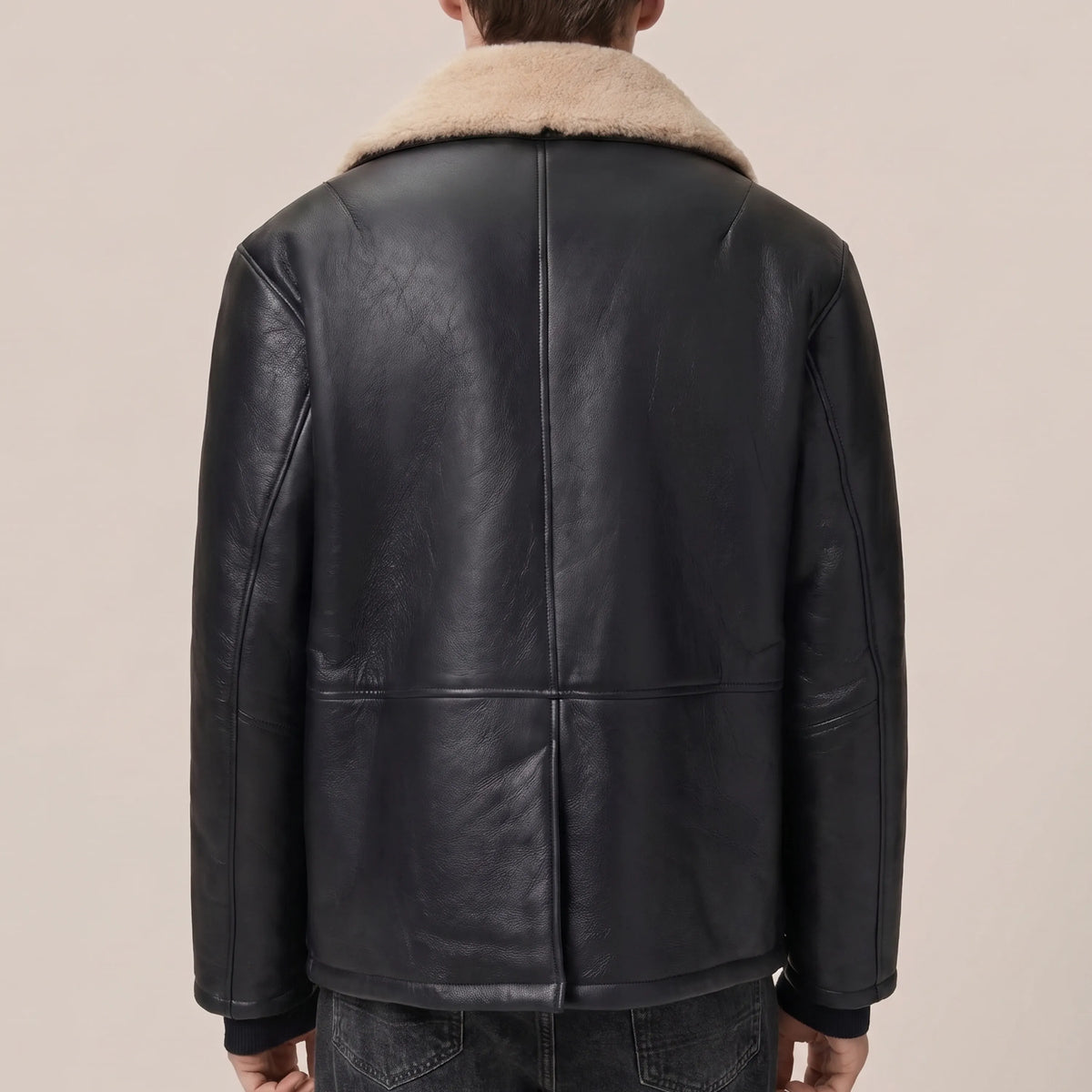 Back view of men’s black leather coat with sand shearling collar