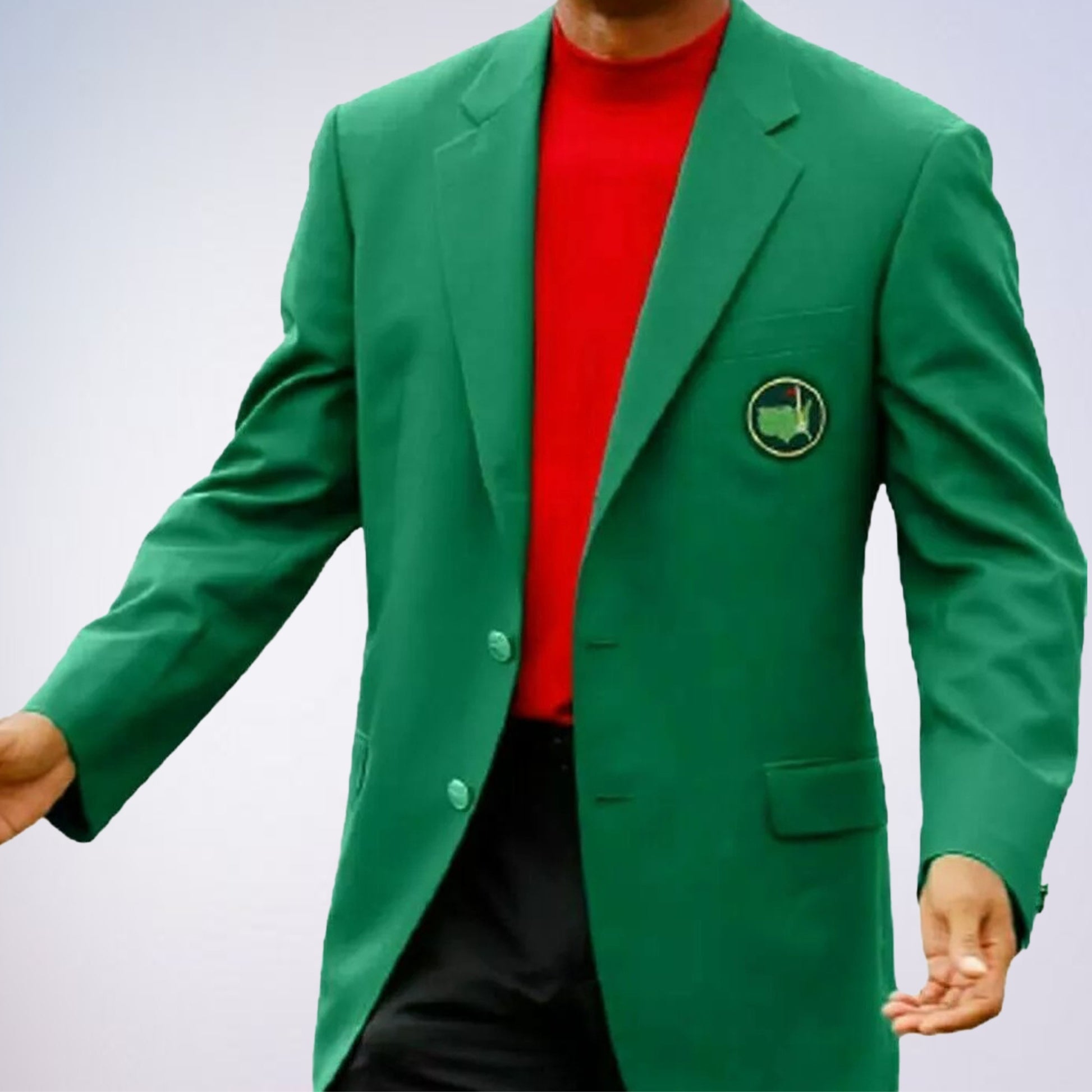 The blazer is a formal jacket, typically associated with prestigious events or organizations. The emblem on the pocket appears to be a map outline with a flag, which is often associated with the Masters Tournament, a major golf championship. 