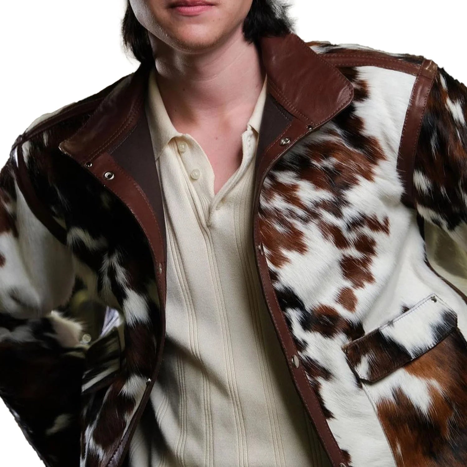 Man wearing a rugged genuine cow skin leather cowboy jacket with classic Western styling, standing confidently outdoors.