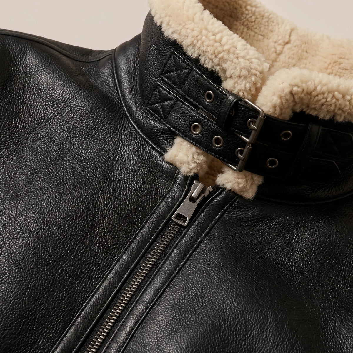 Close-up of cream shearling collar on black B-3 aviator jacket