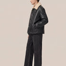 Gunmetal hardware on black cowhide shearling coat