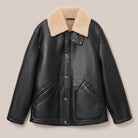 Welt pocket detail on black semi-shine leather coat