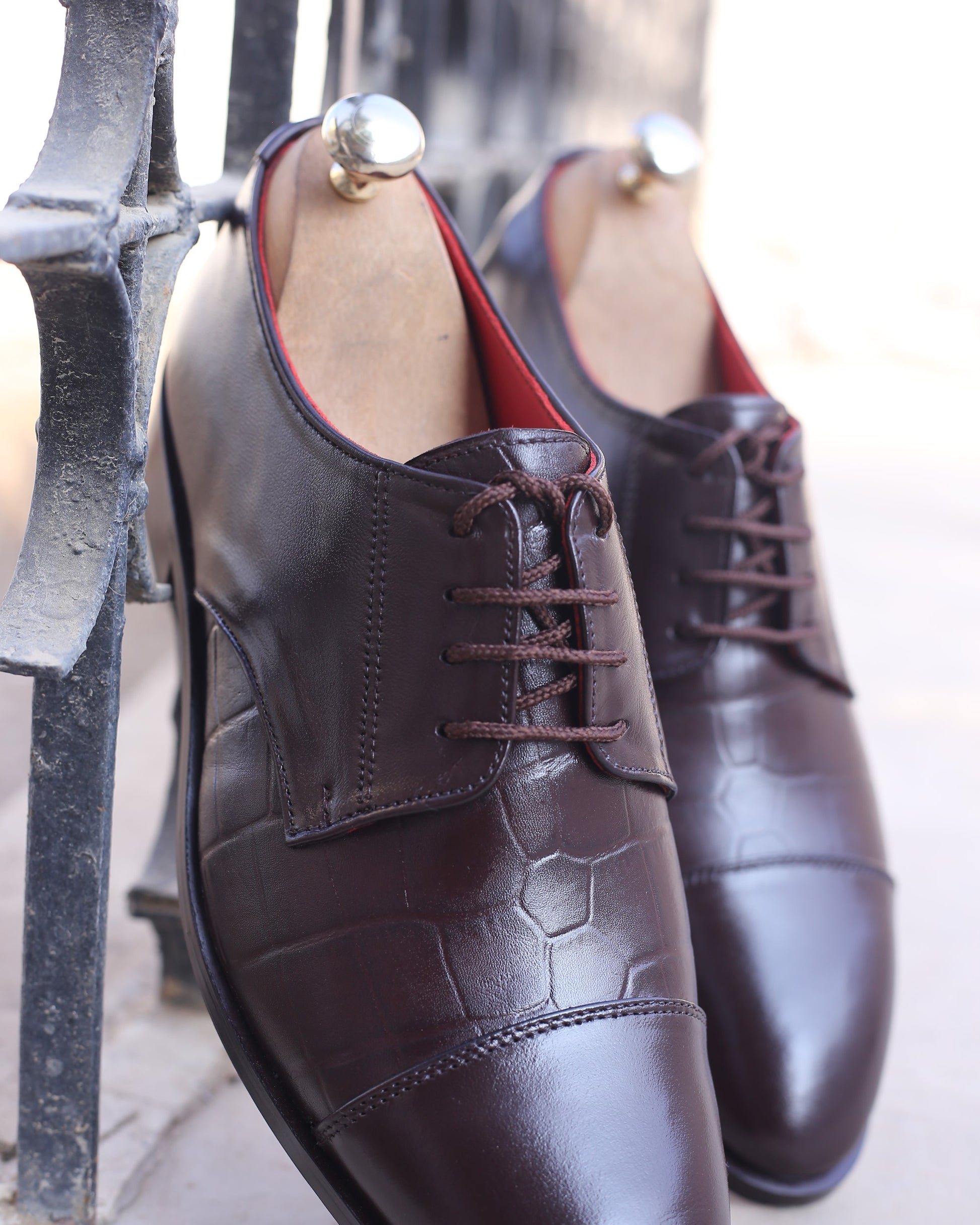 A photo of brown leather derby oxford dress shoes