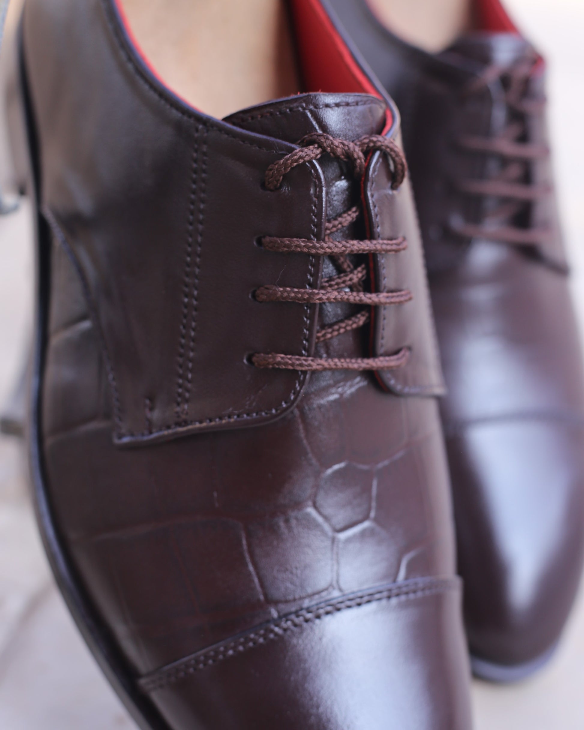 A photo of brown leather derby oxford dress shoes
