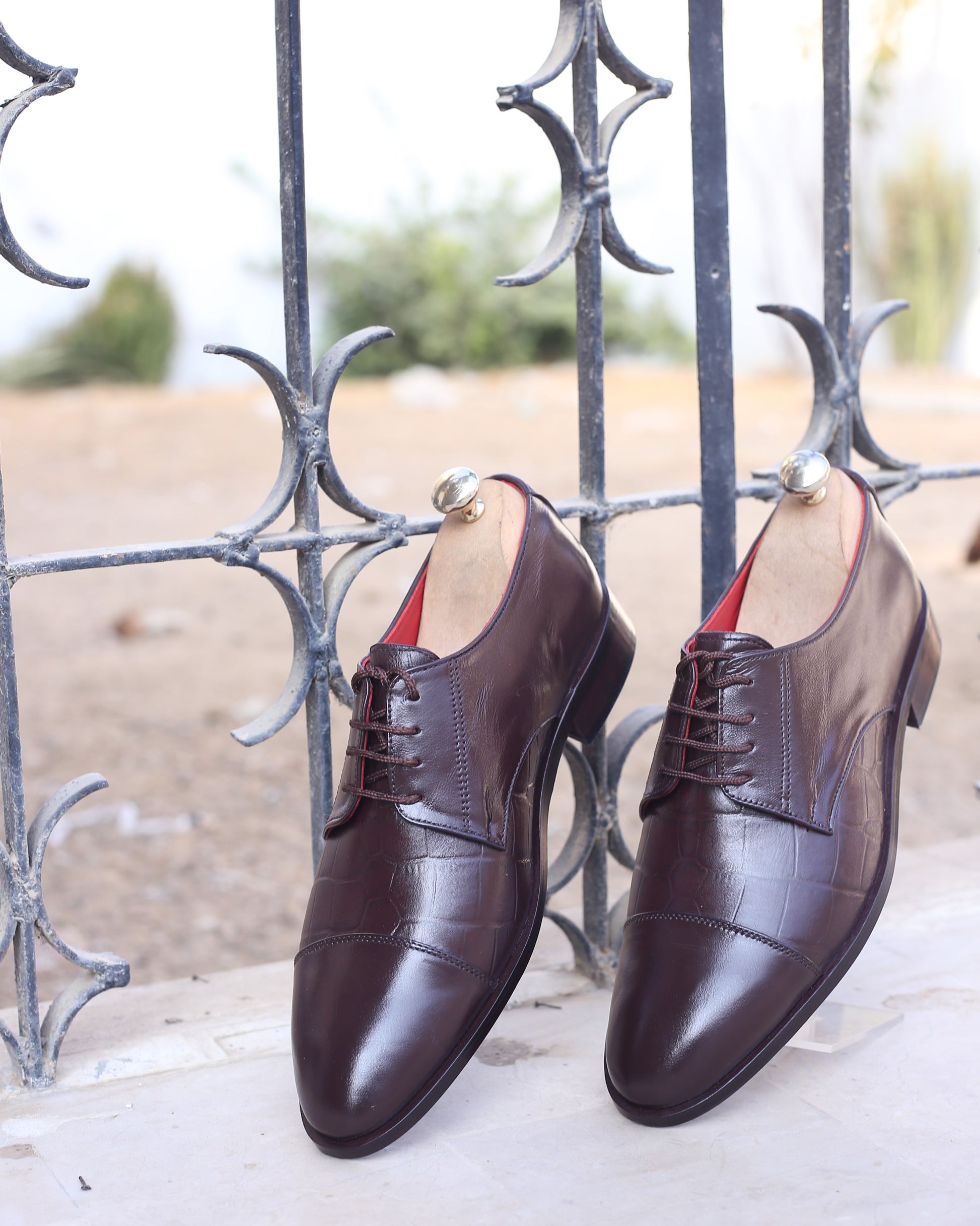 A photo of brown leather derby oxford dress shoes