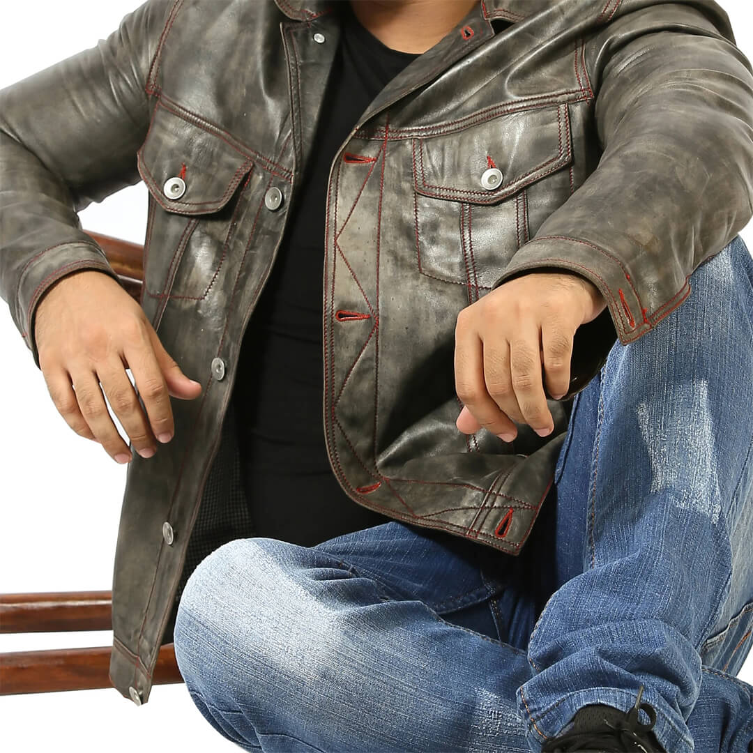 Vintage Men's Leather Motorcycle Jacket with authentic timeless style on wooden background.