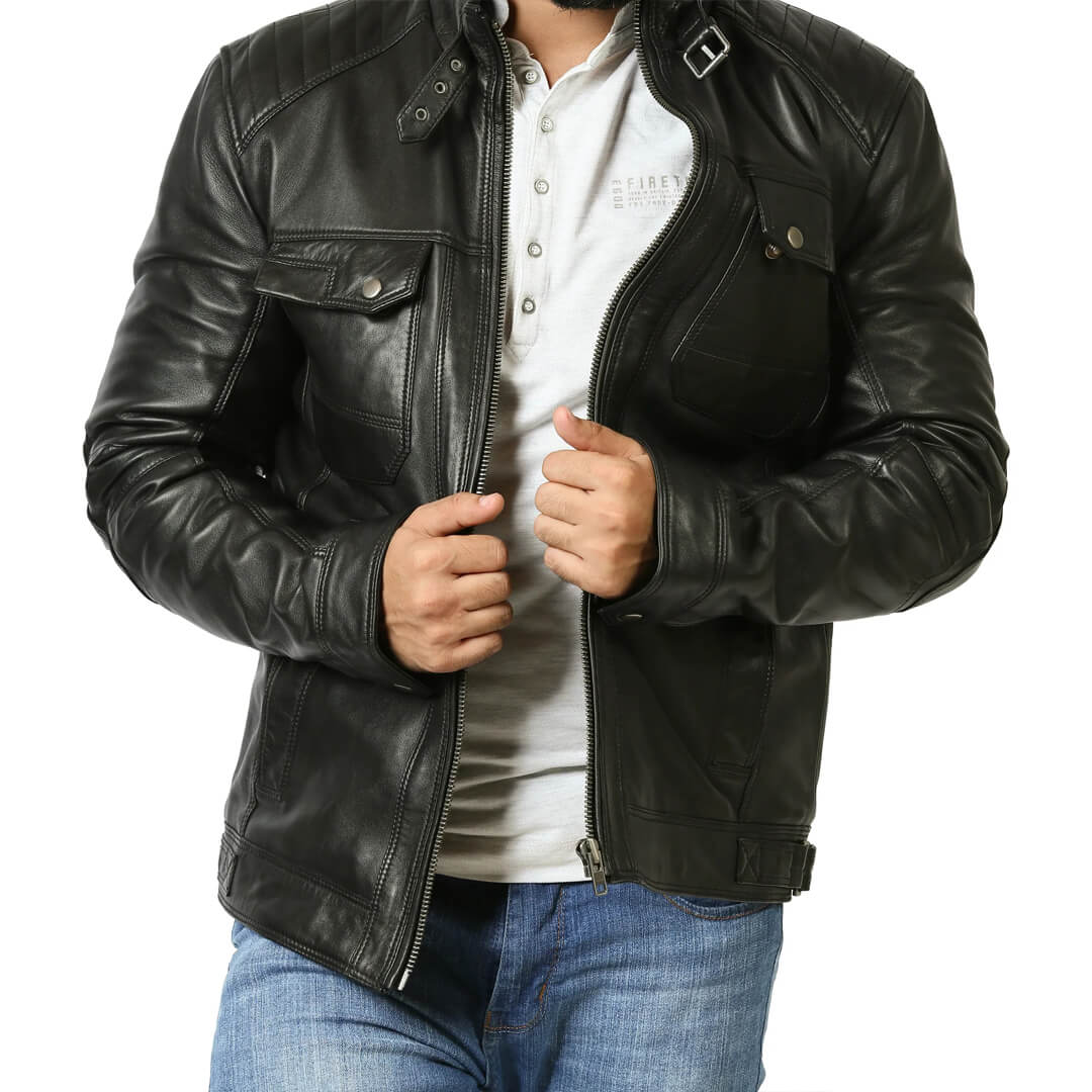 Authentic vintage black leather biker jacket on a hanger, representing chic retro fashion and timeless style.