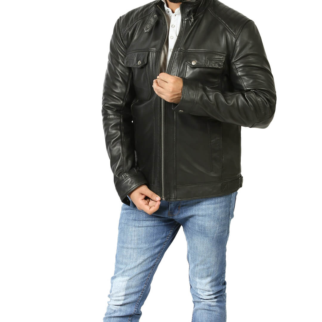 Authentic vintage black leather biker jacket on a hanger, representing chic retro fashion and timeless style.