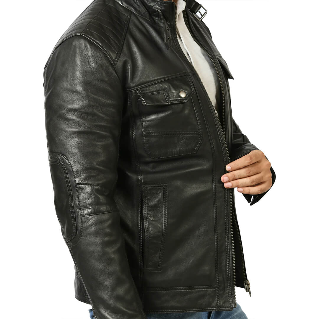 Authentic vintage black leather biker jacket on a hanger, representing chic retro fashion and timeless style.