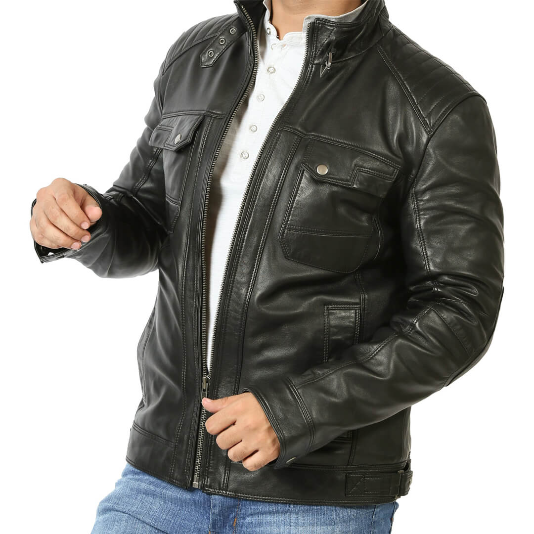 Authentic vintage black leather biker jacket on a hanger, representing chic retro fashion and timeless style.