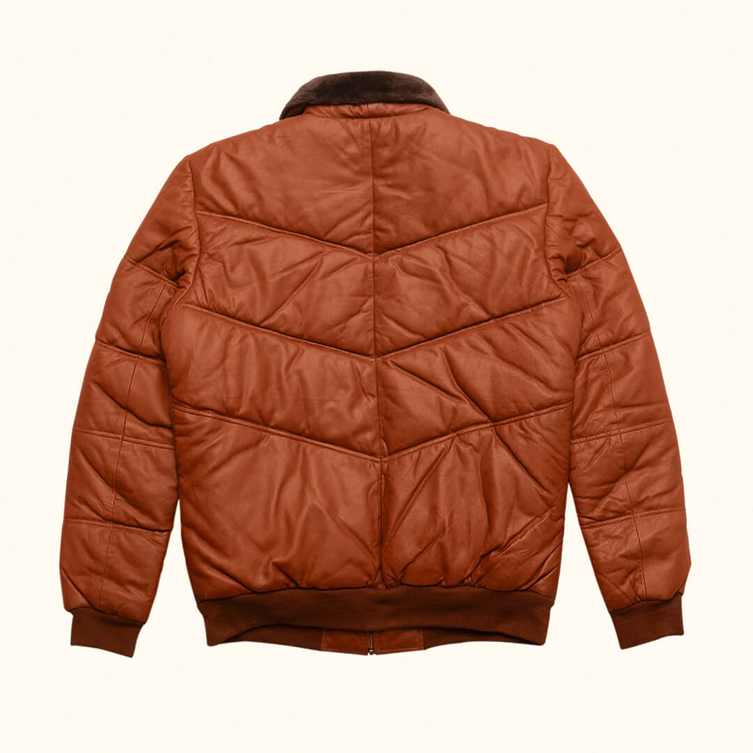 Warm Griffin Puffer Jacket in rich brown color, displayed as essential gear for cold climates, highlighting style and warmth.