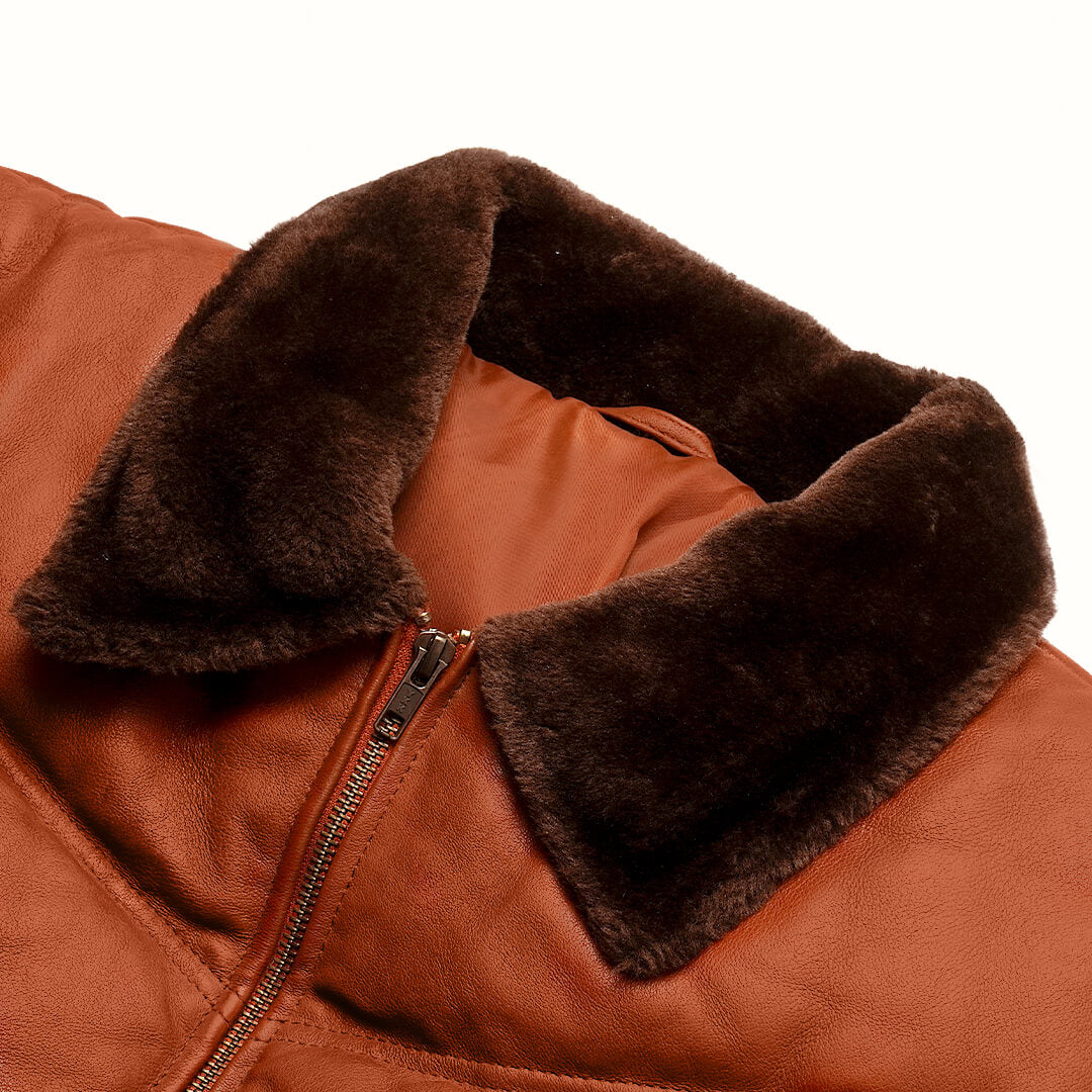 Warm Griffin Puffer Jacket in rich brown color, displayed as essential gear for cold climates, highlighting style and warmth.