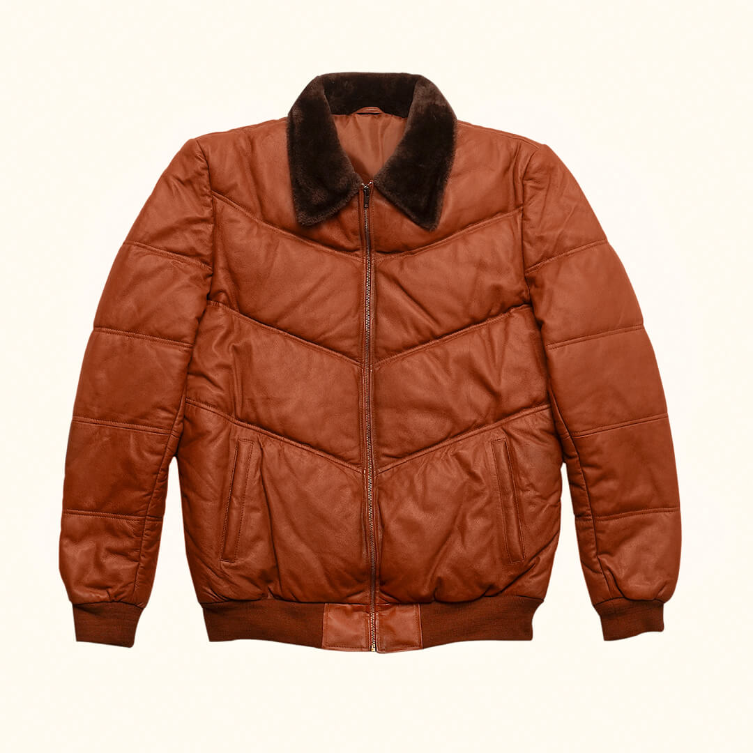 Warm Griffin Puffer Jacket in rich brown color, displayed as essential gear for cold climates, highlighting style and warmth.