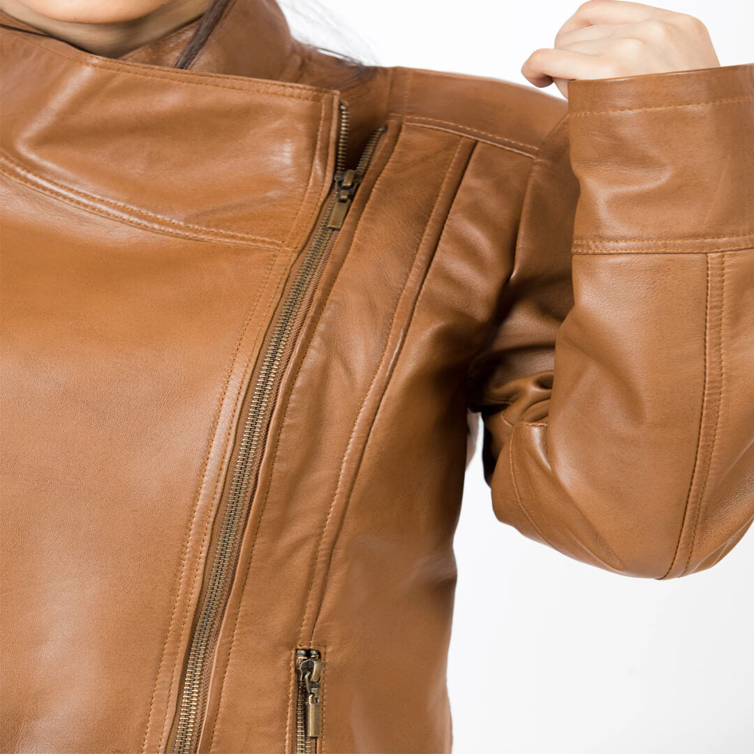 Chic women's brown genuine leather slim fit biker jacket, stylish and durable motorcycle gear.