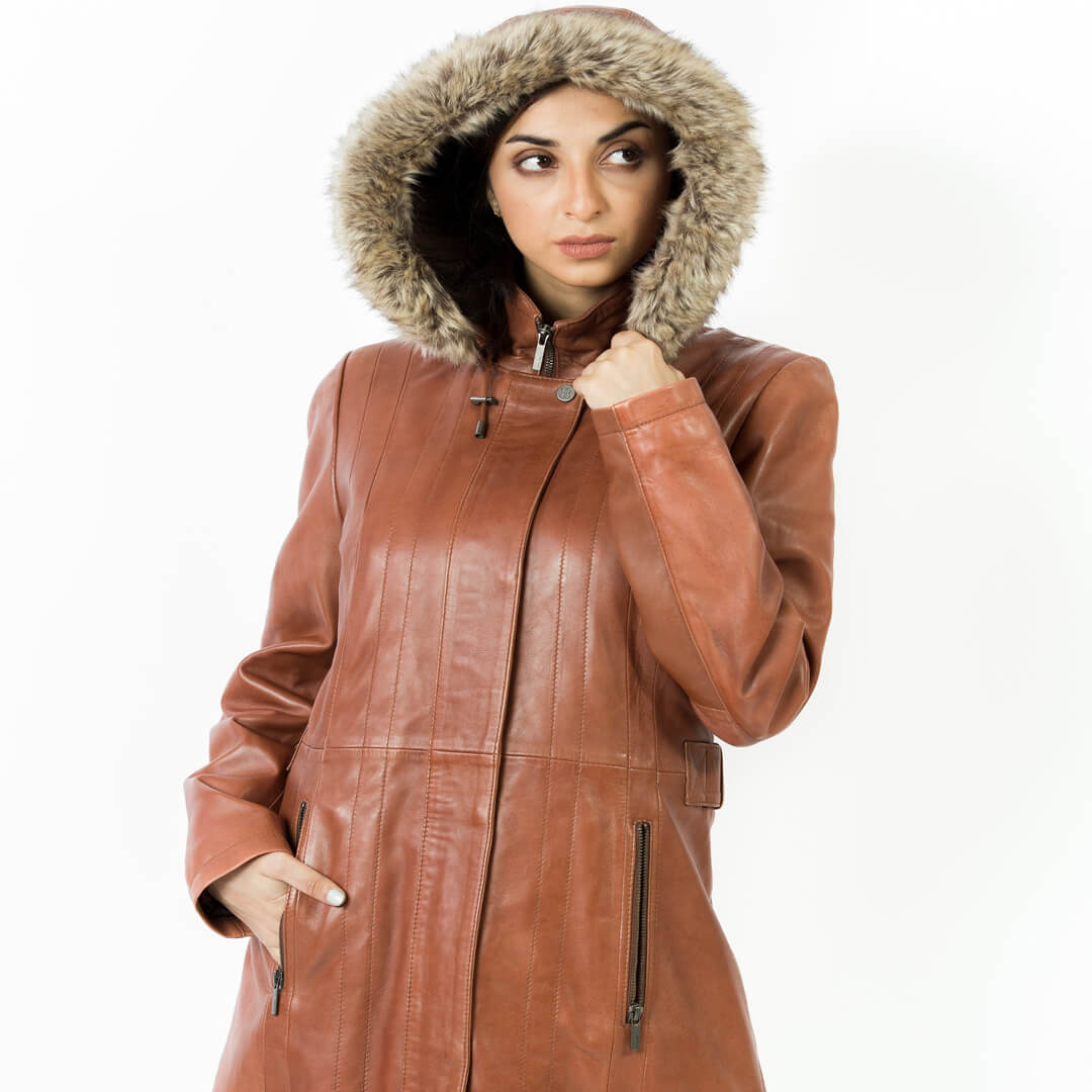 Woman's chic red leather hooded jacket, stylish and long, perfect for winter outerwear fashion.