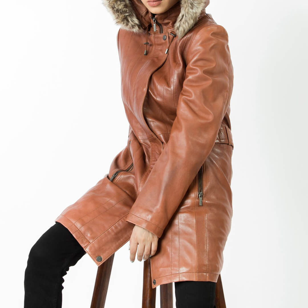 Woman's chic red leather hooded jacket, stylish and long, perfect for winter outerwear fashion.