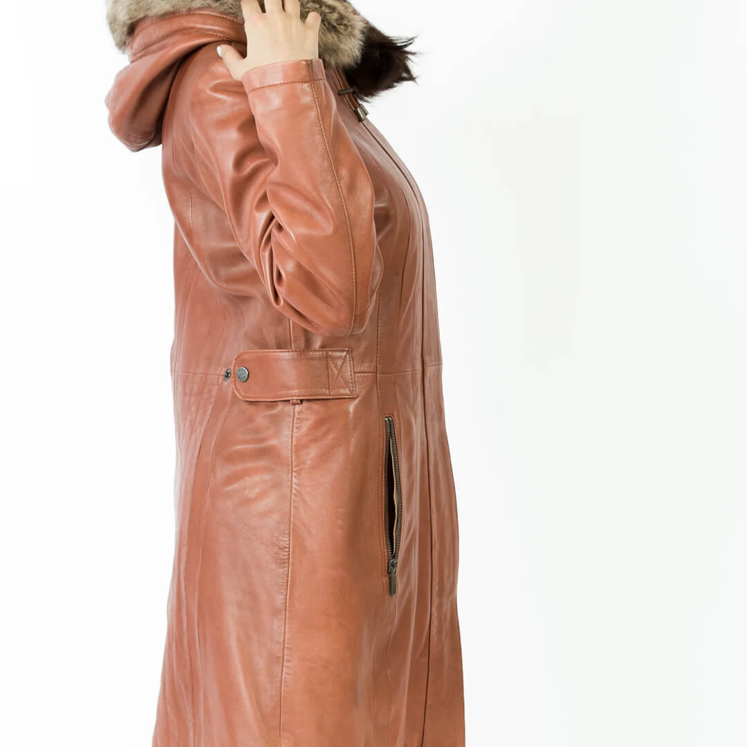 Woman's chic red leather hooded jacket, stylish and long, perfect for winter outerwear fashion.