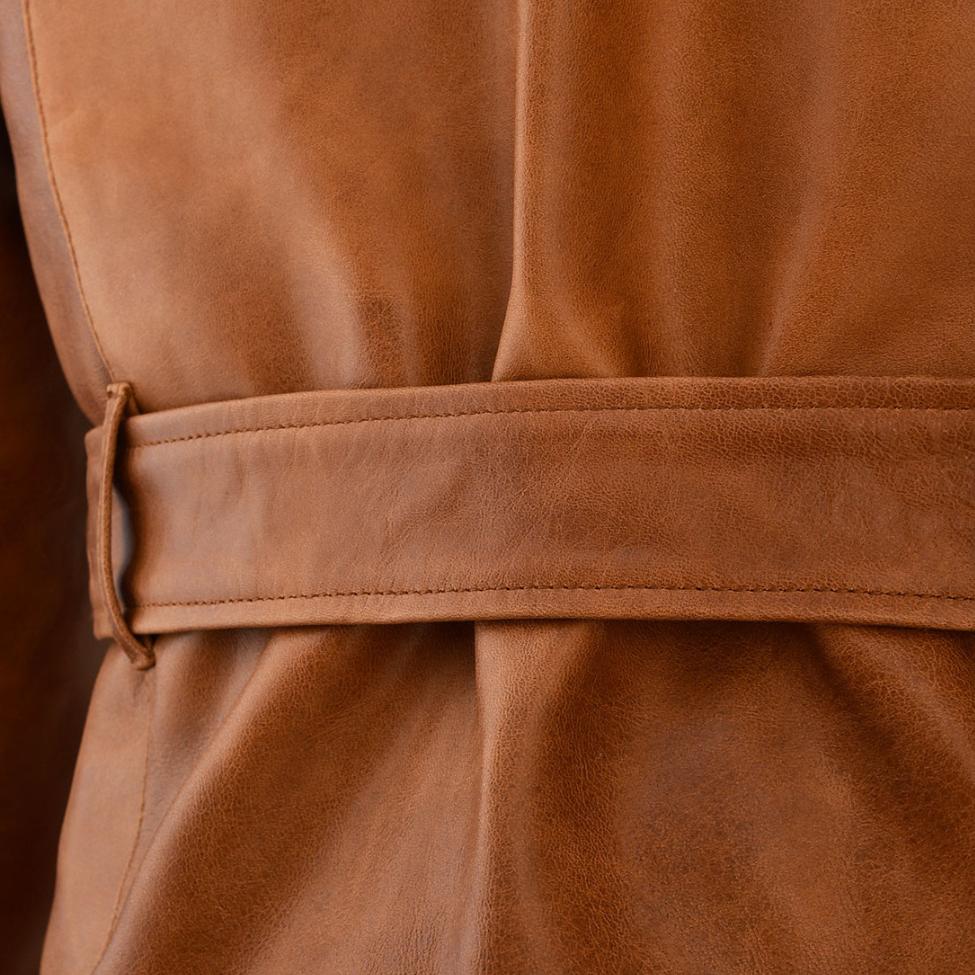 Men's brown lambskin biker jacket. Soft, luxurious leather with belt, zippered pockets, and adjustable cuffs for a comfortable fit.