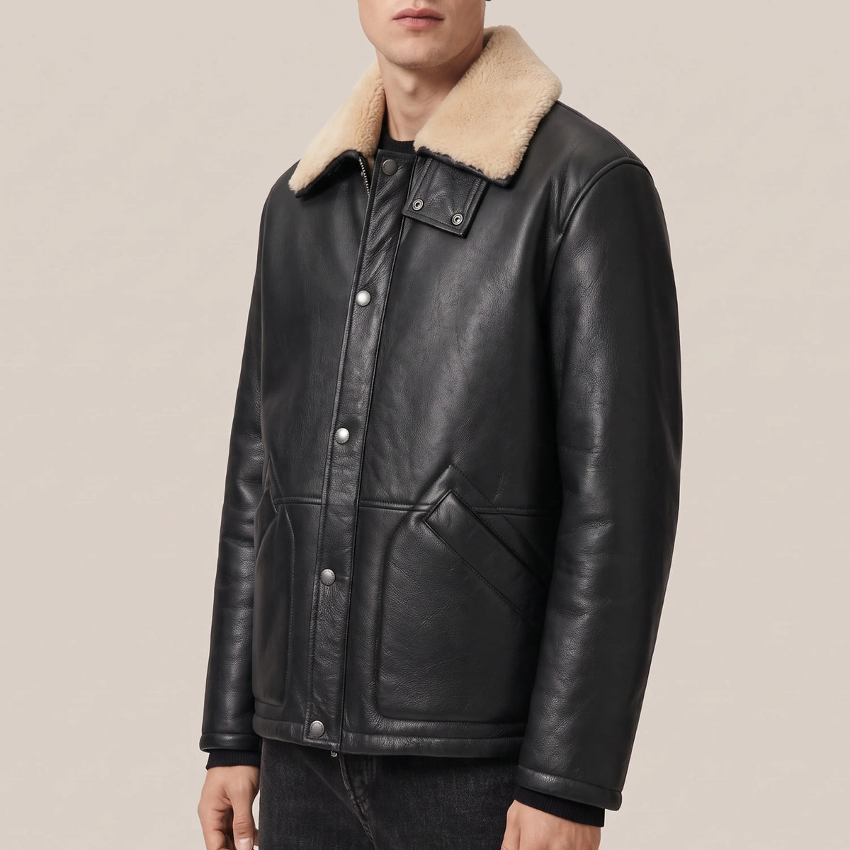 Side view of mid-length black shearling leather coat