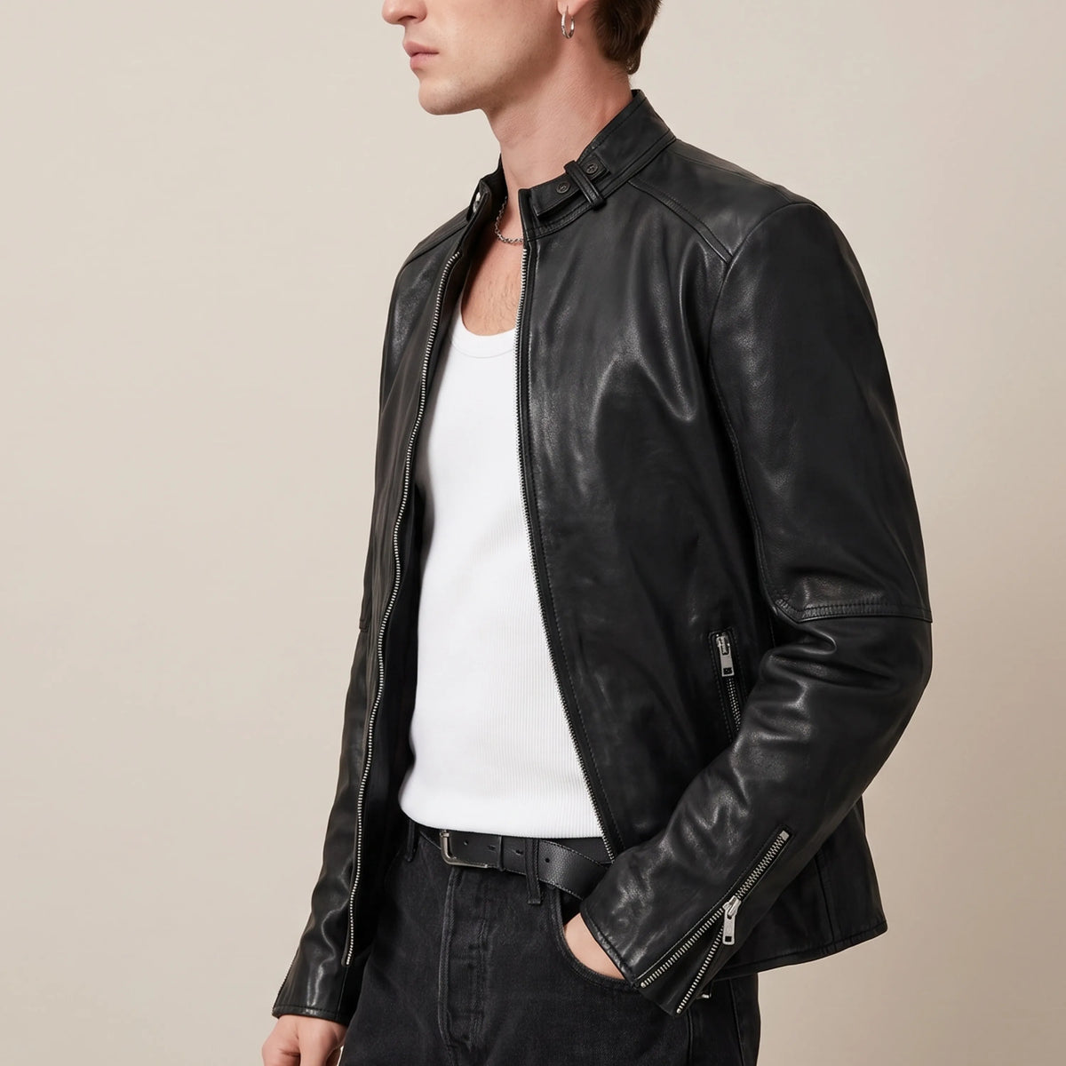 Three-quarter view of men’s jet black leather jacket with snap collar
