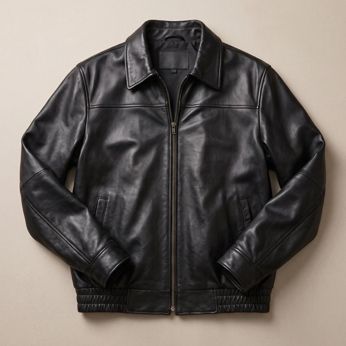 Men’s vintage lambskin bomber jacket worn with jeans, full-length view