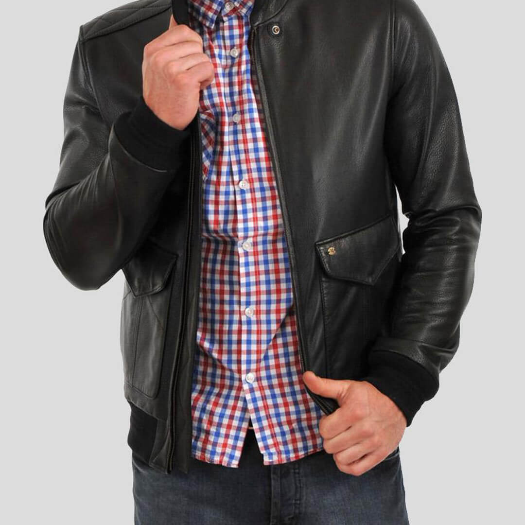 Men's Osian Black Leather Bomber Jacket displaying sleek durability, suitable for both fashionable casual and dressy attire.