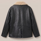 Close-up of sand shearling collar on black leather coat