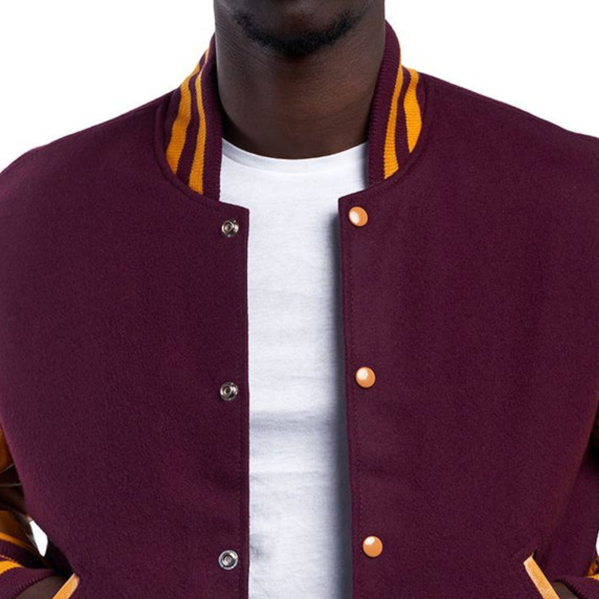 A Maroon varsity jacket with Yellow leather sleeves. The jacket has yellow and black striped cuffs, collar, and waistband.